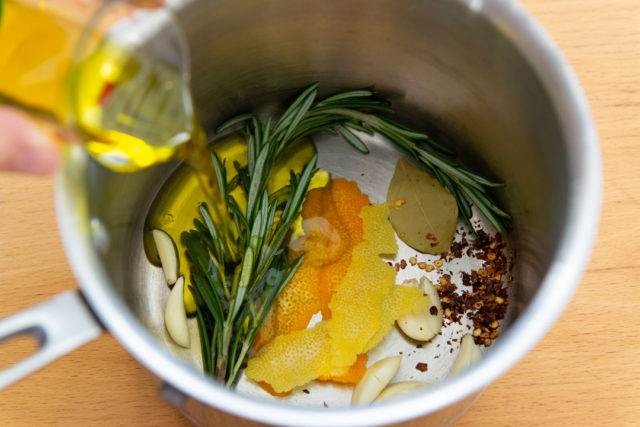 Olive Oil, Rosemary, Citrus Zest, and Chili Flakes in Saucepan