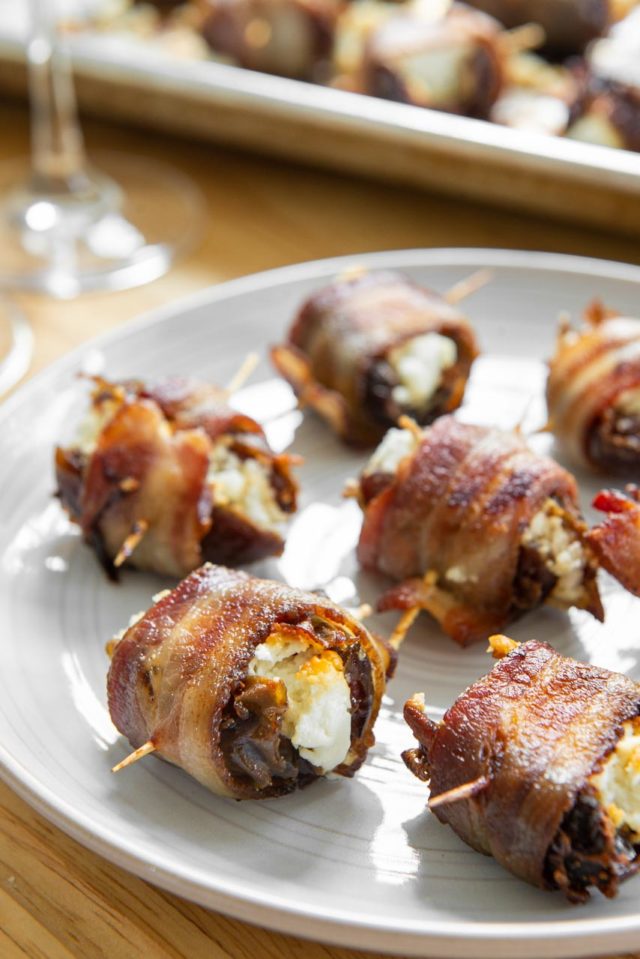Bacon Wrapped Dates Goat Cheese - Served on a Gray Plate with Toothpick Handles