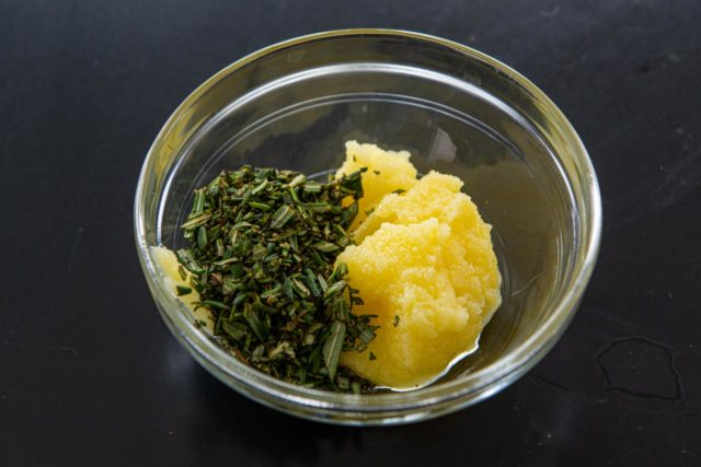Ghee and Chopped Rosemary in a Small Glass Bowl