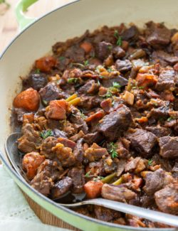 Beef Stew - With Chuck, Carrots, Celery, Rosemary, and Thyme in Green pan