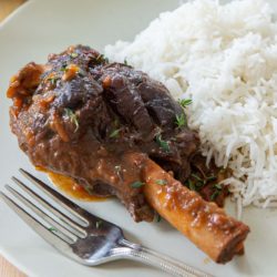 Braised Lamb Shank on Plate with White Steamed Rice