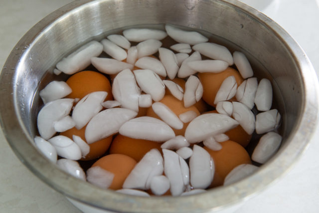 Ice Bath with Boiled Eggs in Stainless Steel Bowl