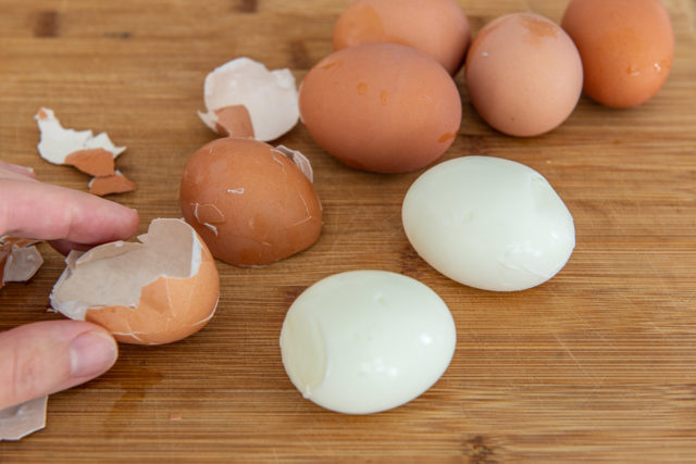 Peeling Hard Boiled Eggs and Showing Big Pieces for Easy Peeling