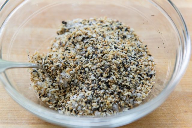 Everything But the Bagel Seasoning Recipe - In a Glass Bowl Mixed with Spoon