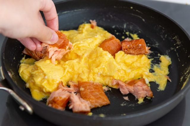 Adding Chunks of Hot Smoked Salmon To The Scrambled Eggs