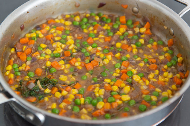 Vegetables Simmering in Gravy in Pan