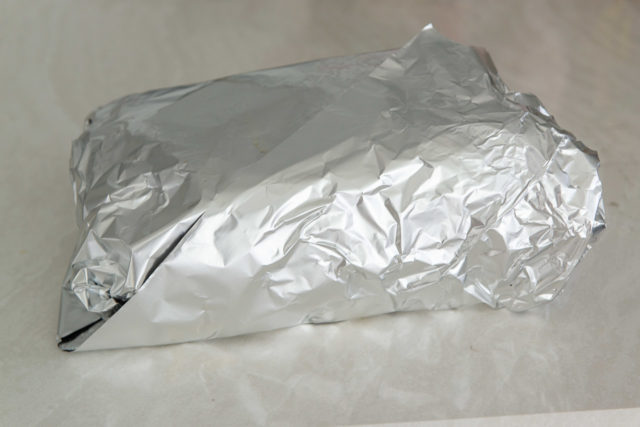 The Meat Completely Wrapped in Aluminum Foil for the Final Cook