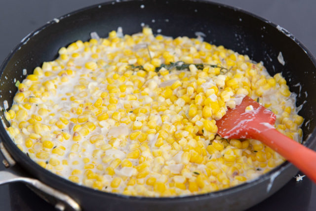 Homemade Cream Corn - In A Skillet with Red Spatula