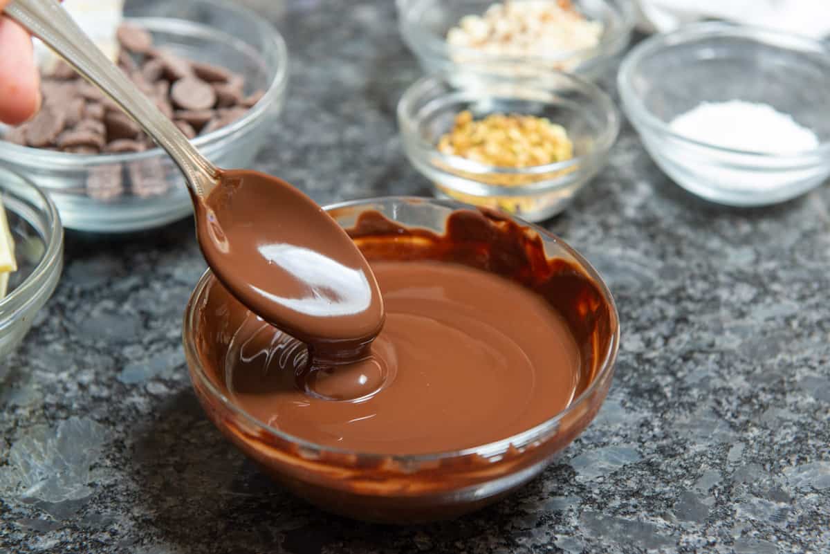 Melted Chocolate in a Glass Bowl with Spoon
