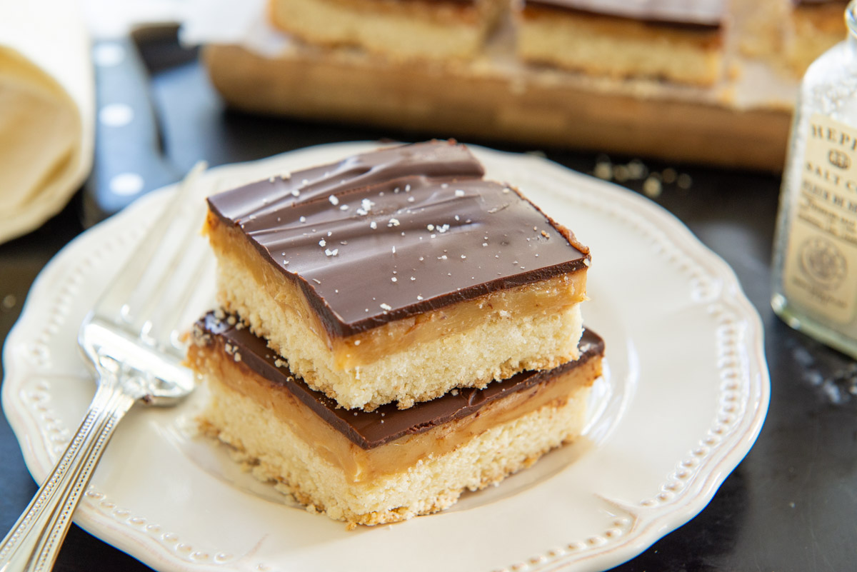 Millionaire's Shortbread Recipe Shown Baked and Cut Into Squares on a Plate
