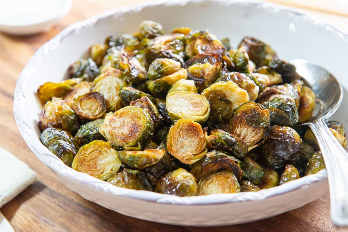Oven Roasted Brussel Sprouts in a White Bowl
