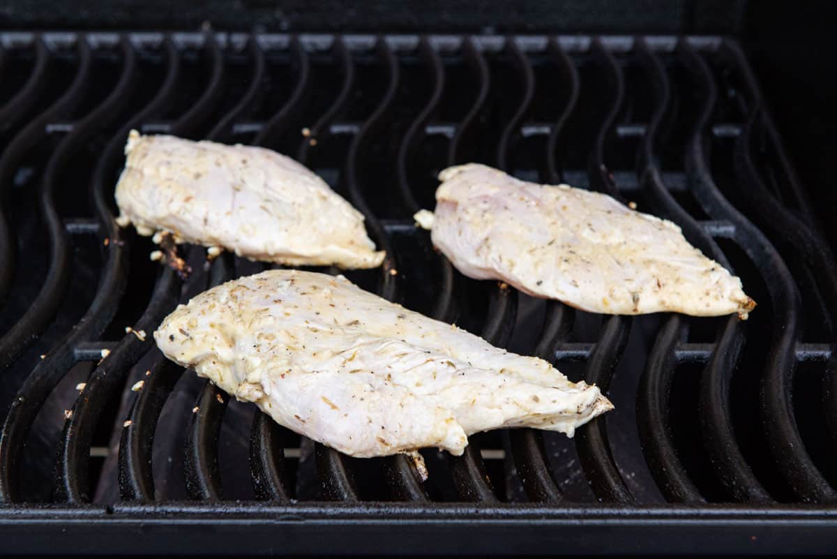 Raw Chicken Breasts on Gas Grill Cooking