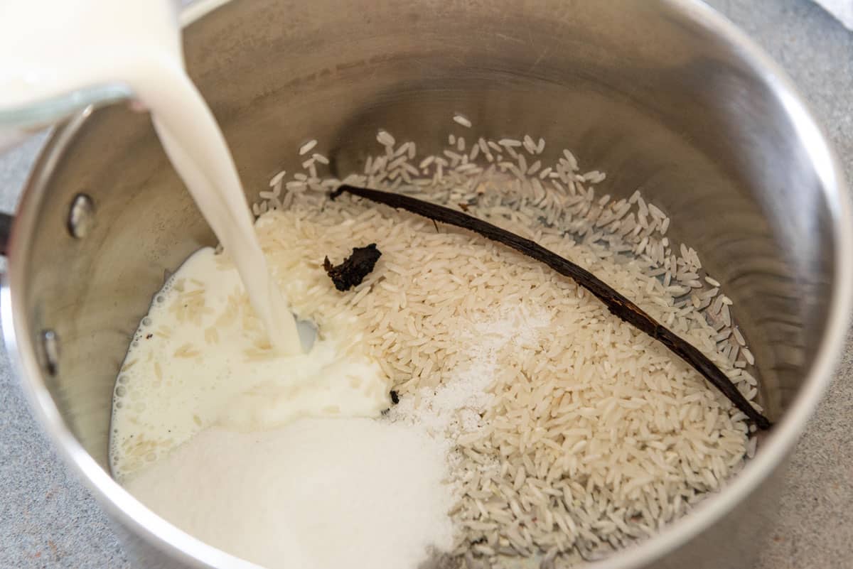Long Grain Rice, A Scraped Vanilla Bean, Sugar, and Whole Milk in Saucepan