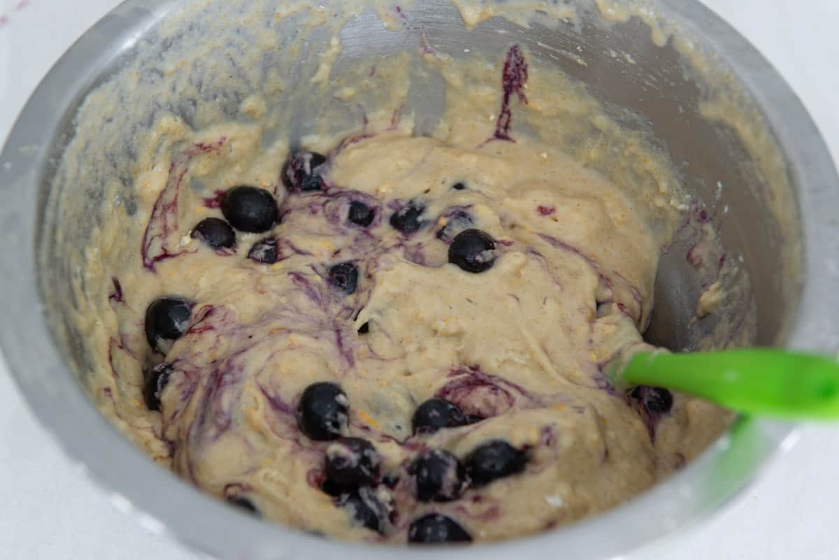Frozen blueberries stirred into the muffin batter