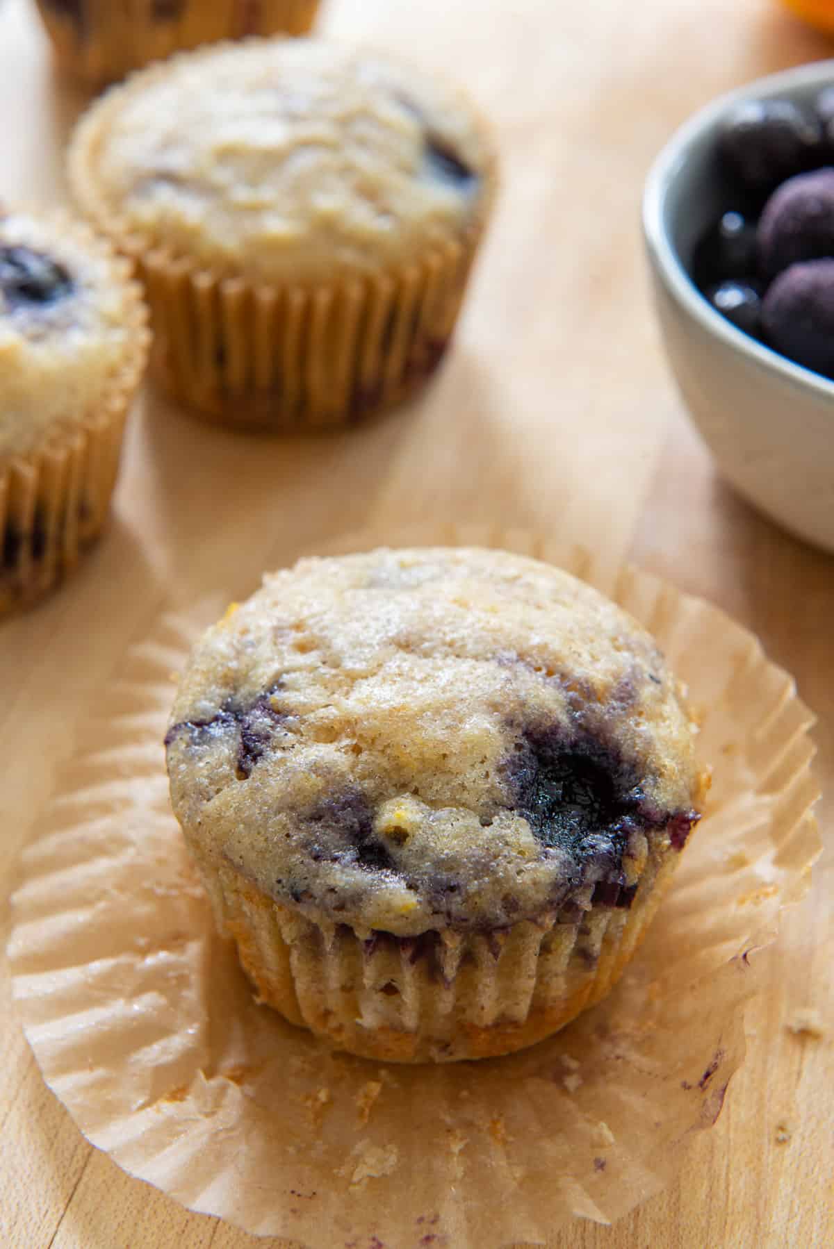 Sourdough Blueberry Muffins Unwrapped On a Wooden Board