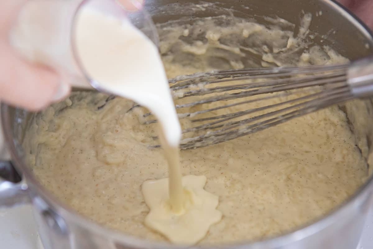 Pouring Cream into Simmered Homemade Mixture