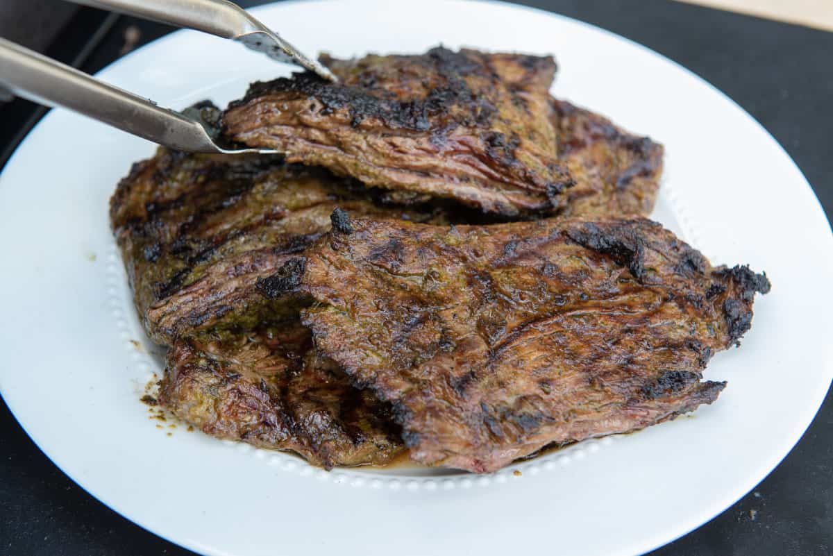 Removing Grilled Carne Asada to a Plate 