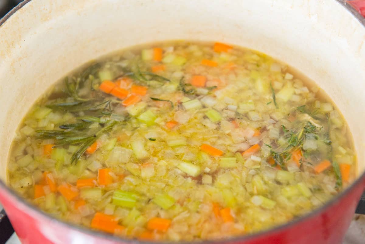 Cooked Onion, Celery, Carrots, and Herbs in Pot
