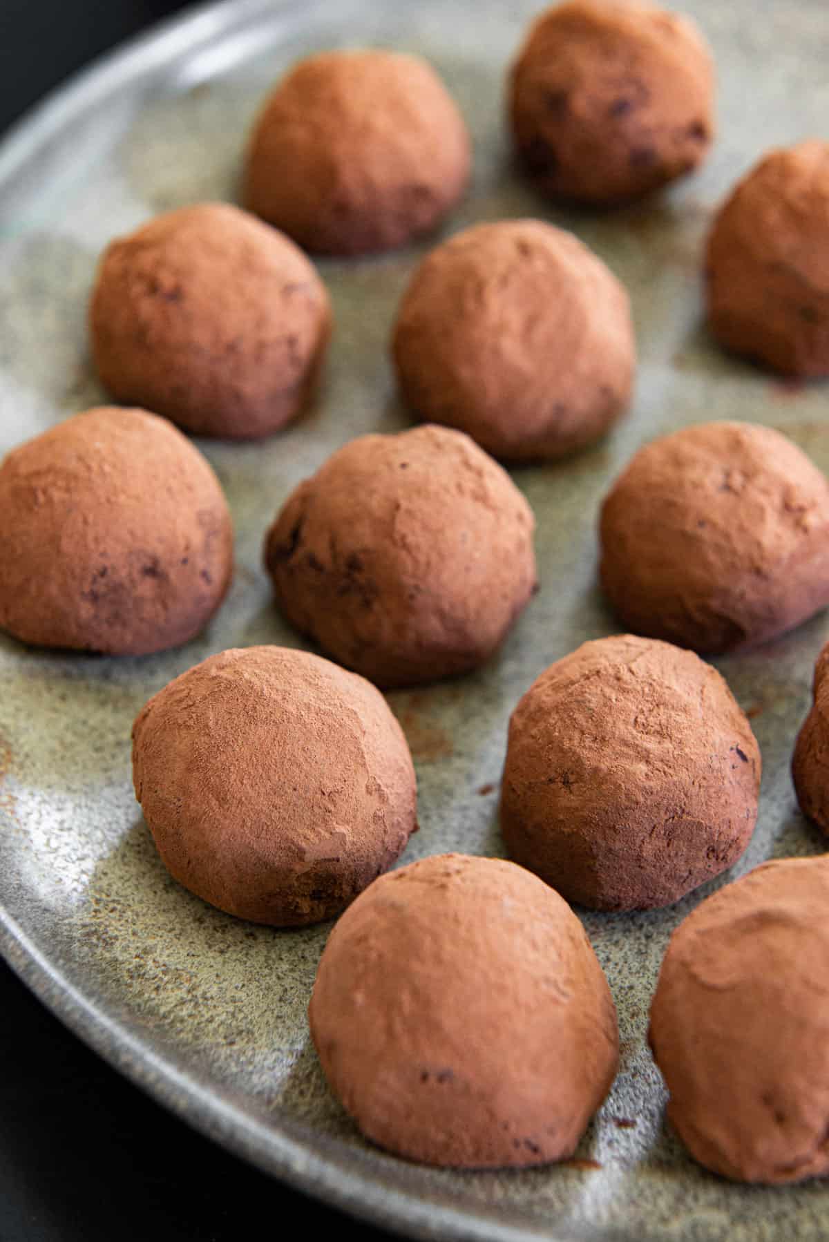 Homemade Chocolate Truffles On a Plate with Cocoa Powder Coating