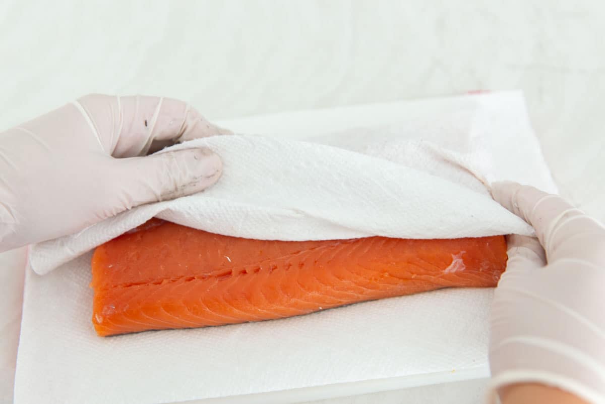 Blotting the Fish Dry with Paper Towel