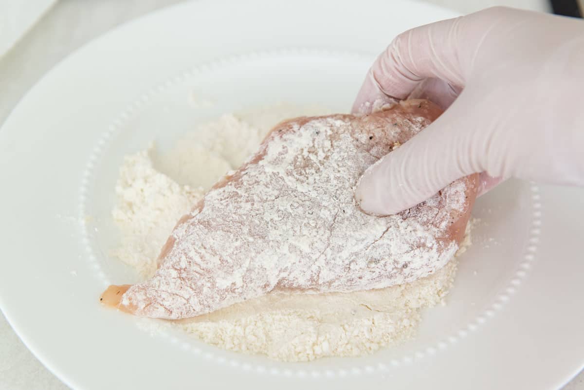 Coating the Breast Pieces In Flour