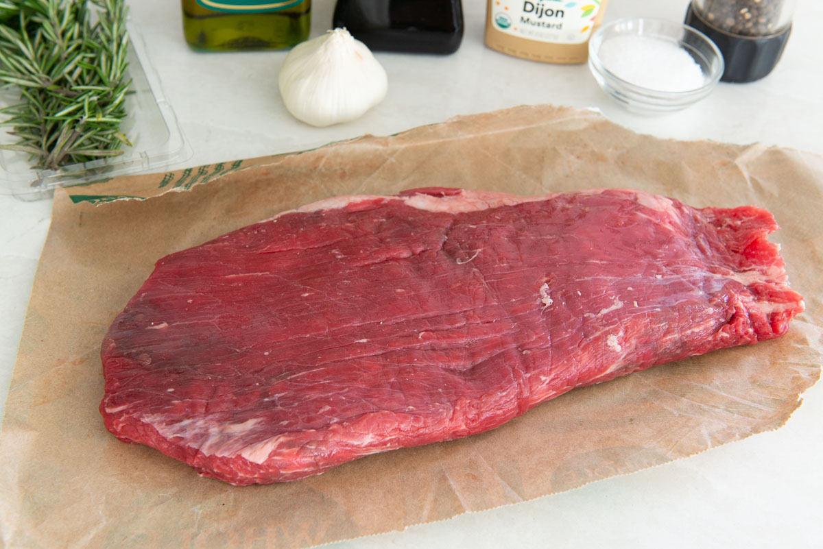 A raw piece of Flank Steak on Butcher Paper