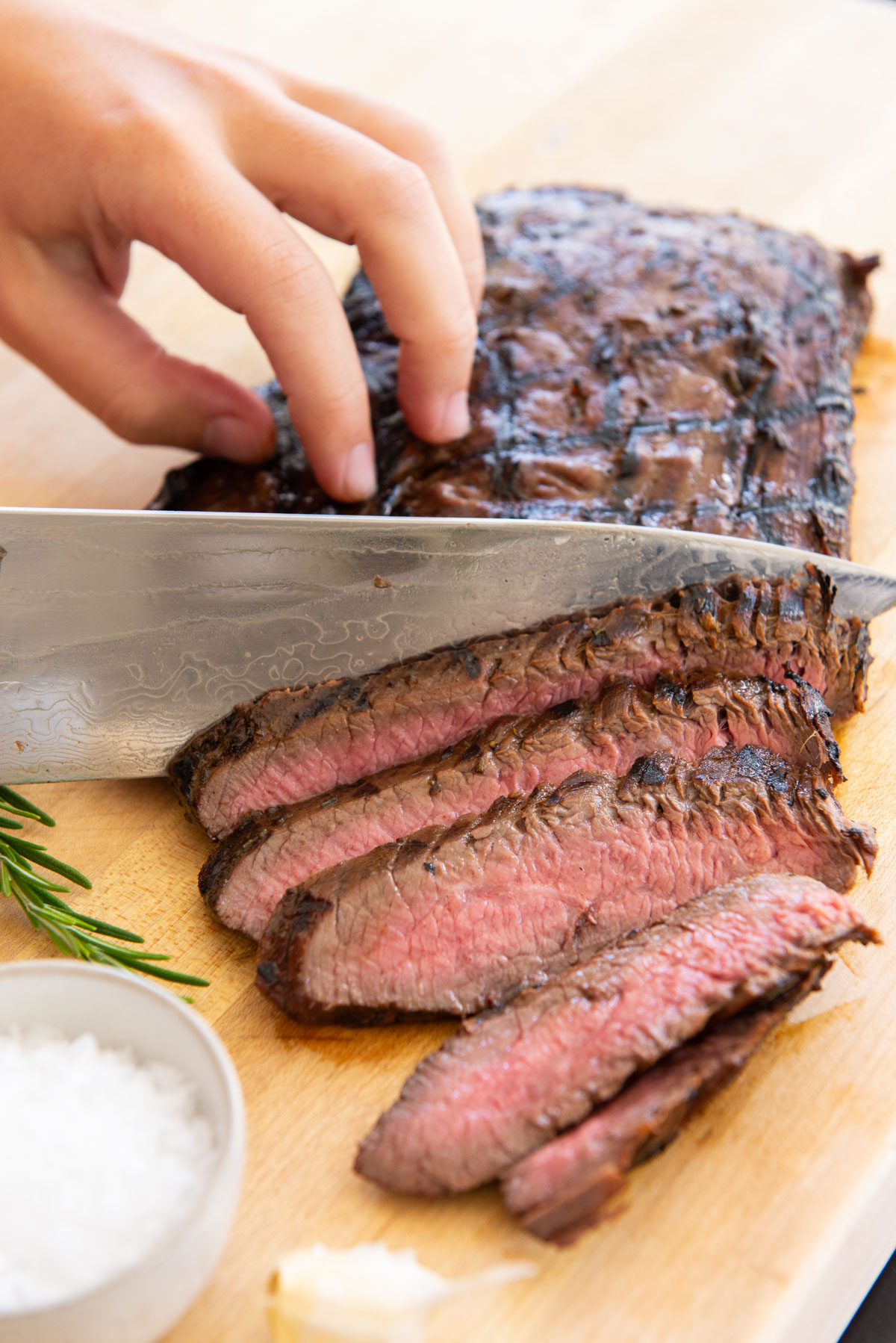 Grilled Flank Steak Sliced On a Wooden Cutting Board