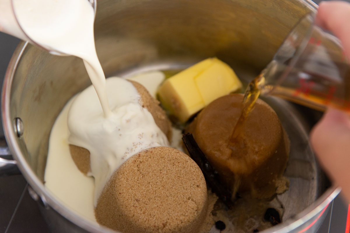 Brown sugar, butter, cream, and whiskey in a saucepan