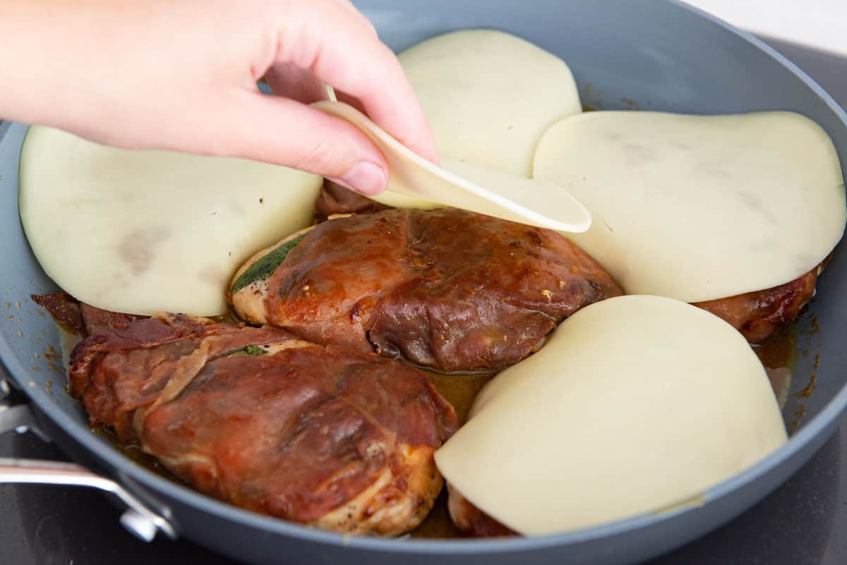 Adding Provolone Cheese Slices In Skillet Before Broiling