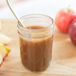 Homemade Caramel Sauce in Jar with Apples