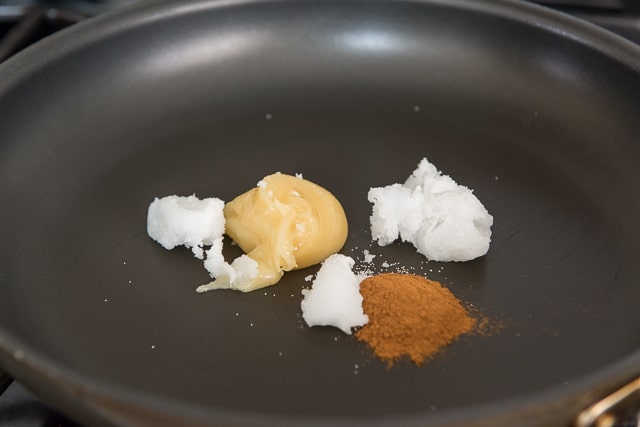 Coconut oil, honey, cinnamon, and salt in a nonstick skillet