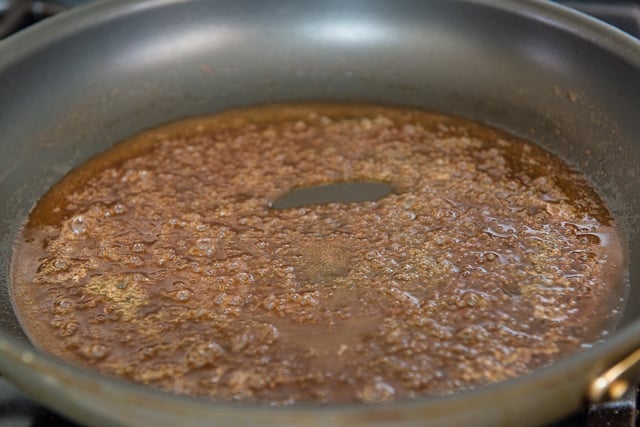 Melted honey coconut oil mixture in skillet bubbling