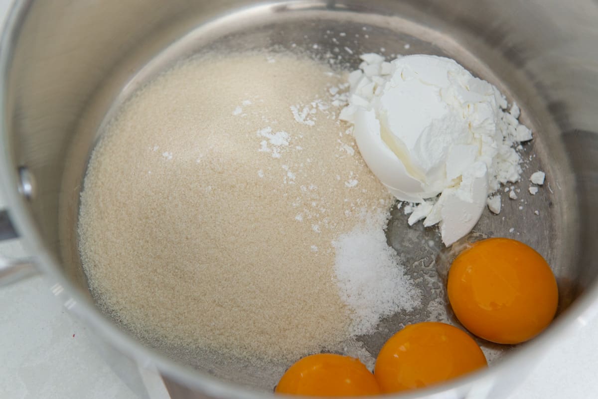 Sugar, cornstarch, salt, and 3 egg yolks in a medium saucepan