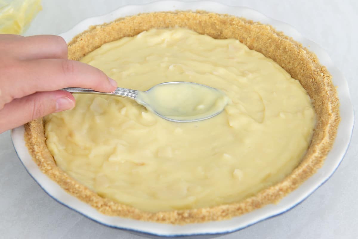 Spreading the filling out into the vanilla wafer crust