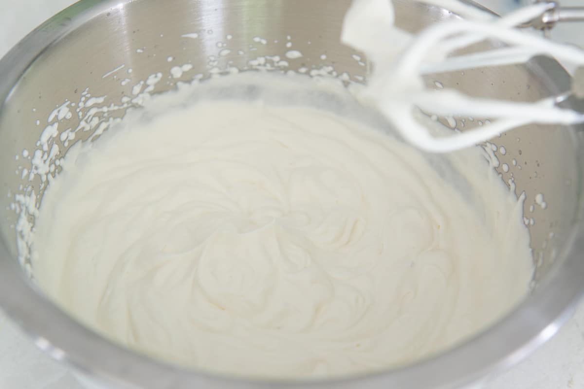 A bowl of whipped cream to stiff peaks with a hand mixer