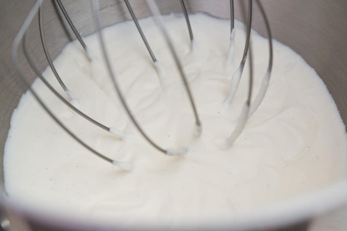 Whipped cream made in the bowl of a stand mixer with the whisk attachment