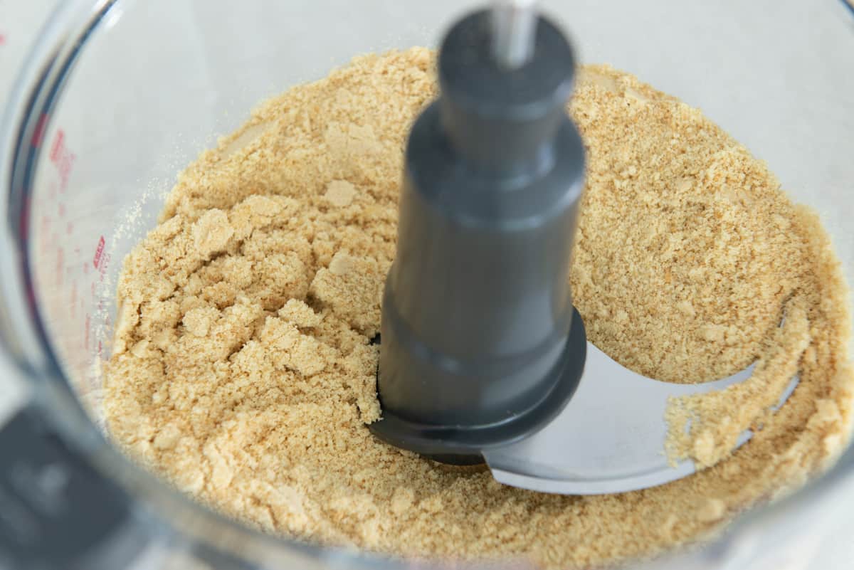 Ground up nilla wafer crumbs in food processor bowl