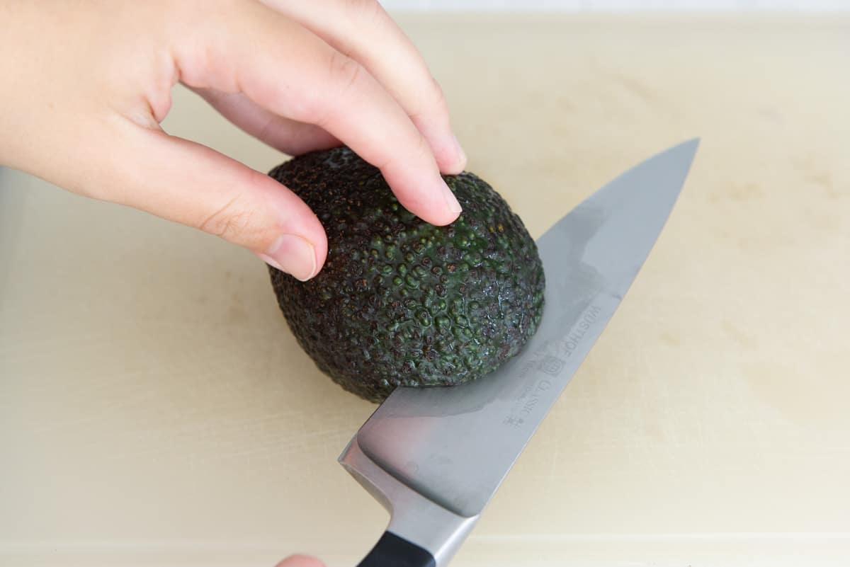 Using a Chef's Knife to Cut Around Avocado Fruit