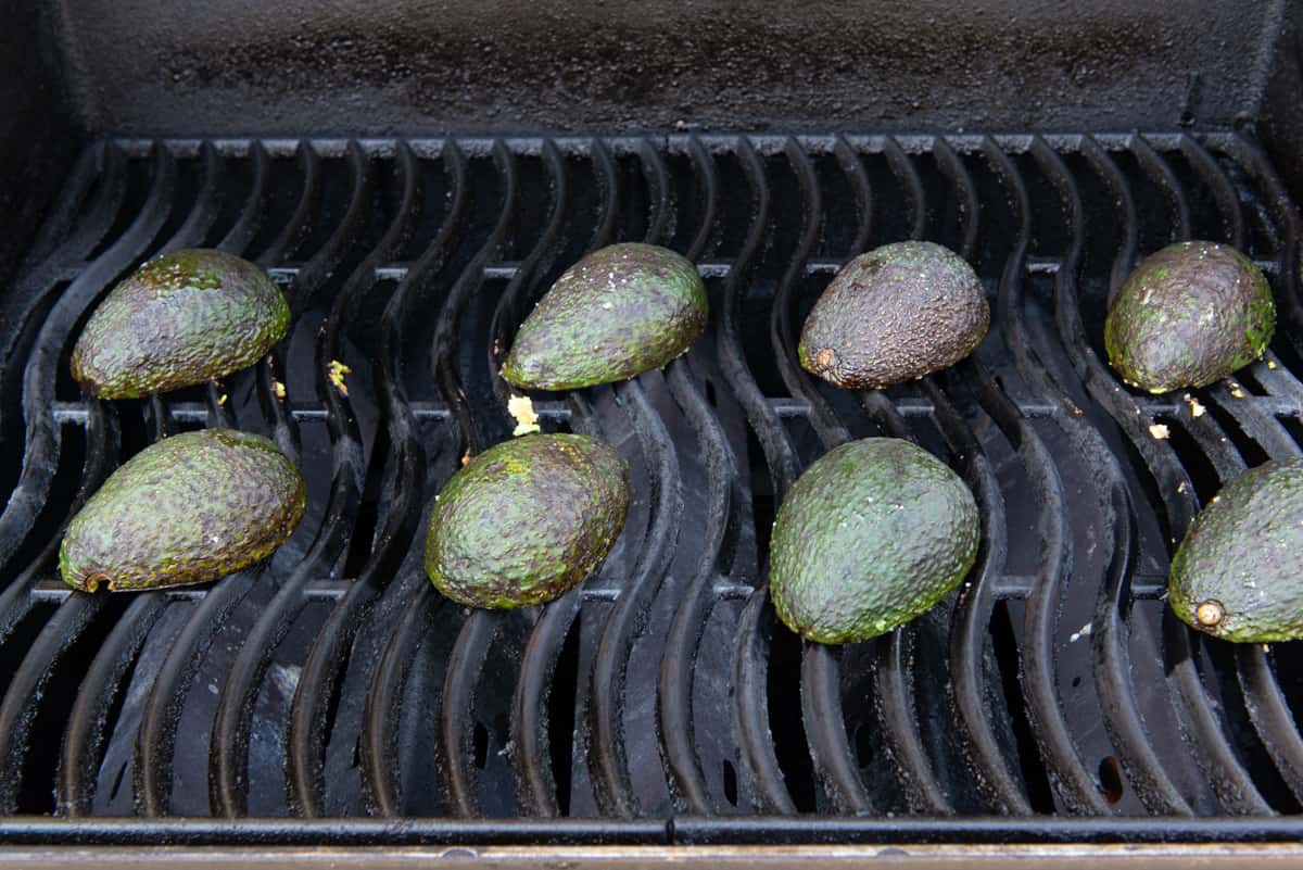 Cut Avocado Halves On a Gas Grill Grate