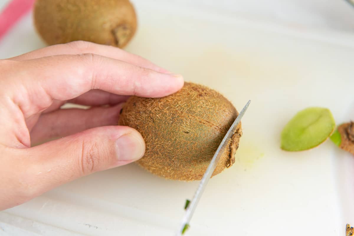 Cutting the End Nubs Off a Kiwi Fruit with Knife