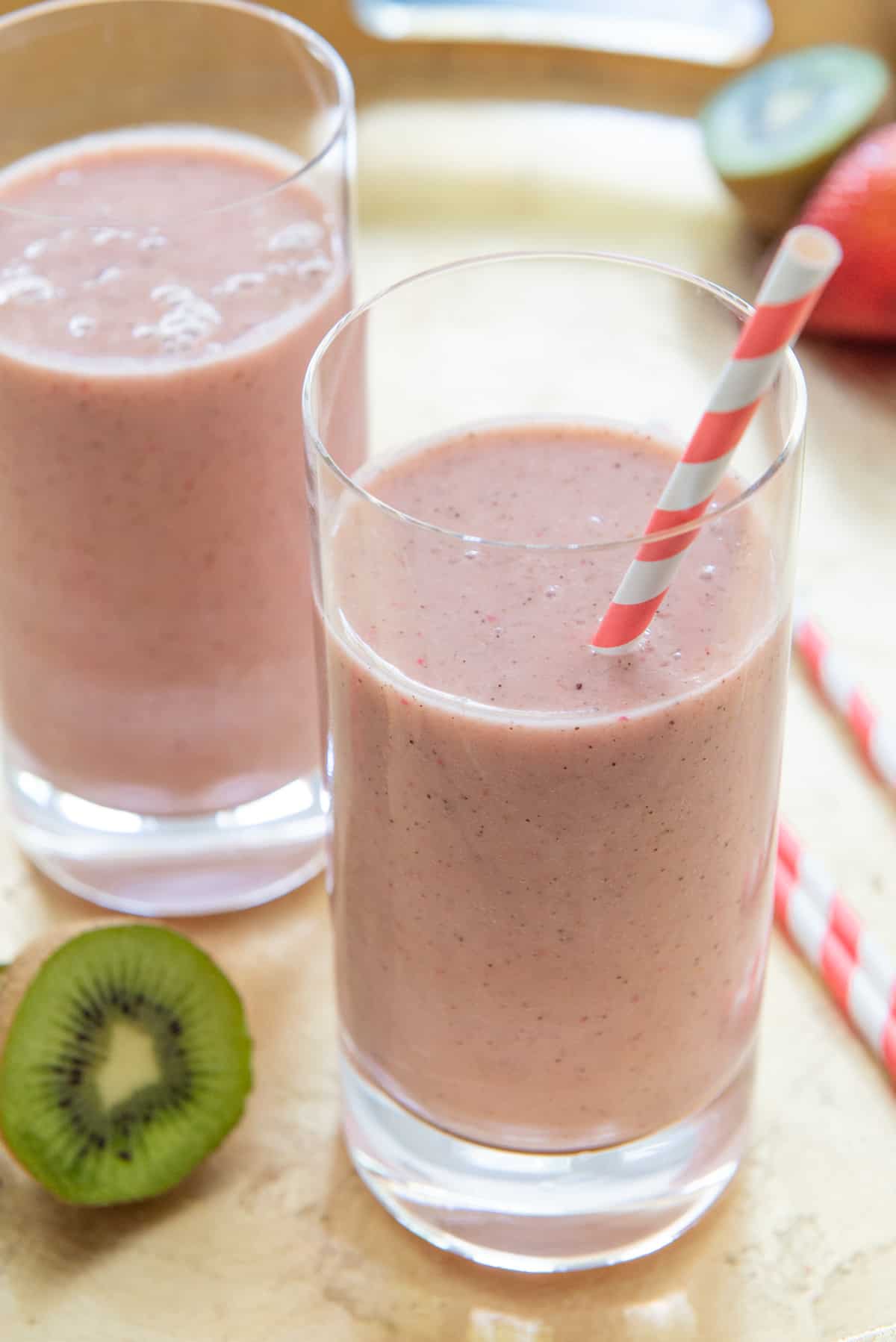 Strawberry Kiwi Smoothie Recipe in Tall Glasses with Paper Straw