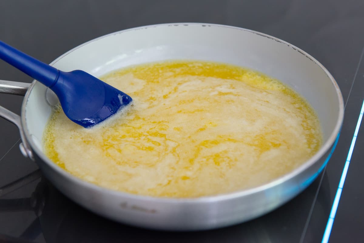 Swirling a Melted Stick of Butter In Saucepan