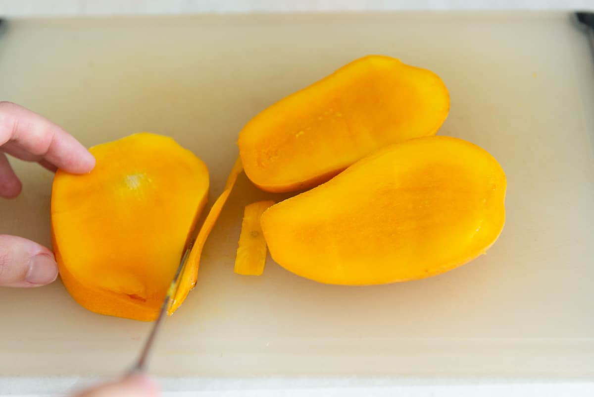 Trimming the Mango Skin From Pit Slice