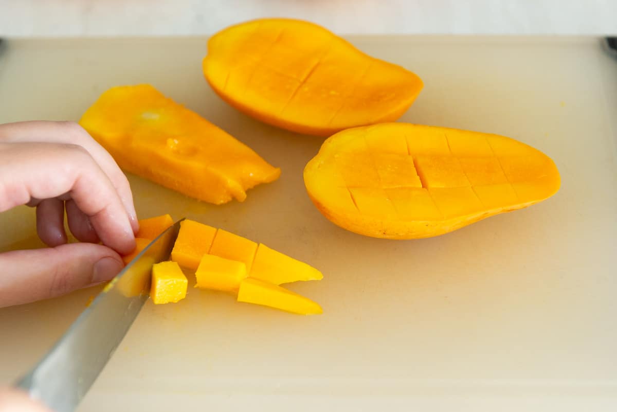 Cutting Mango Strips Into Cubes