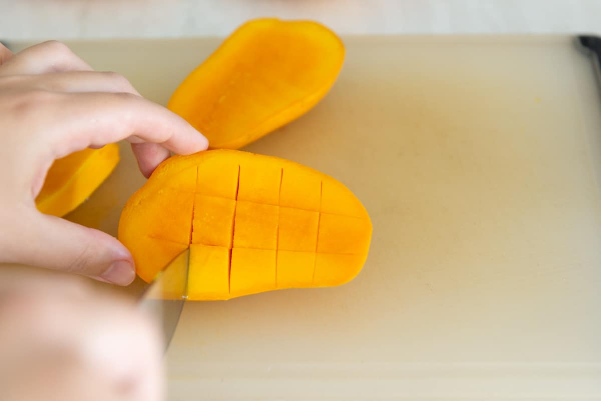 Cutting Mango Half Into Cubes and Grid