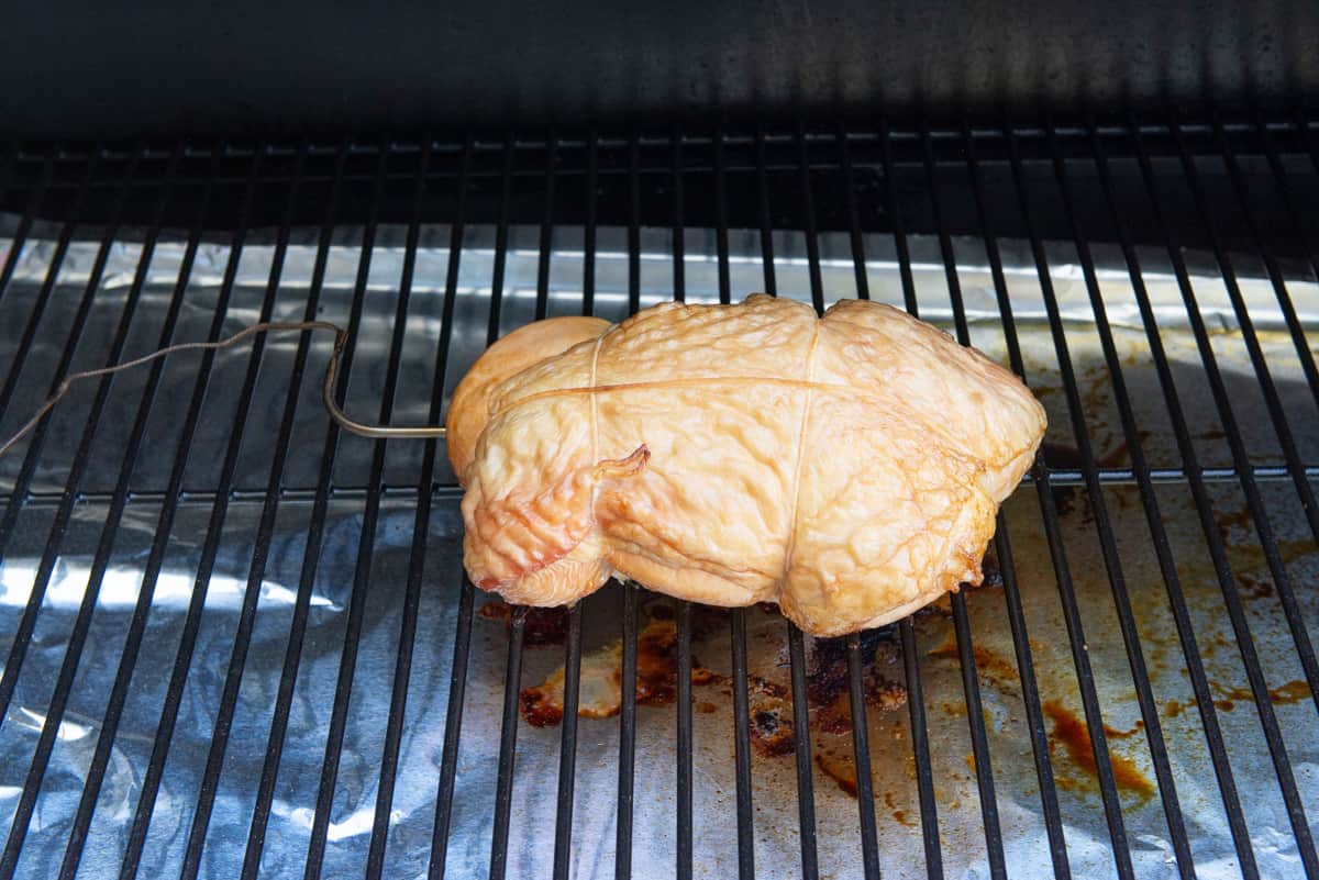 Smoked and Brined Turkey Breast On Traeger Grill Grate With Probe