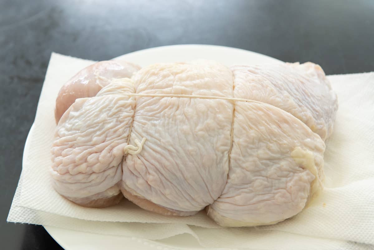 Taking The Brined Turkey Breast Out Of Liquid and On Paper Towel
