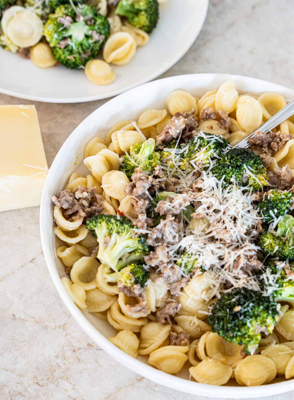Orecchiette pasta topped with italian sausage, broccoli, and shredded parmesean cheese