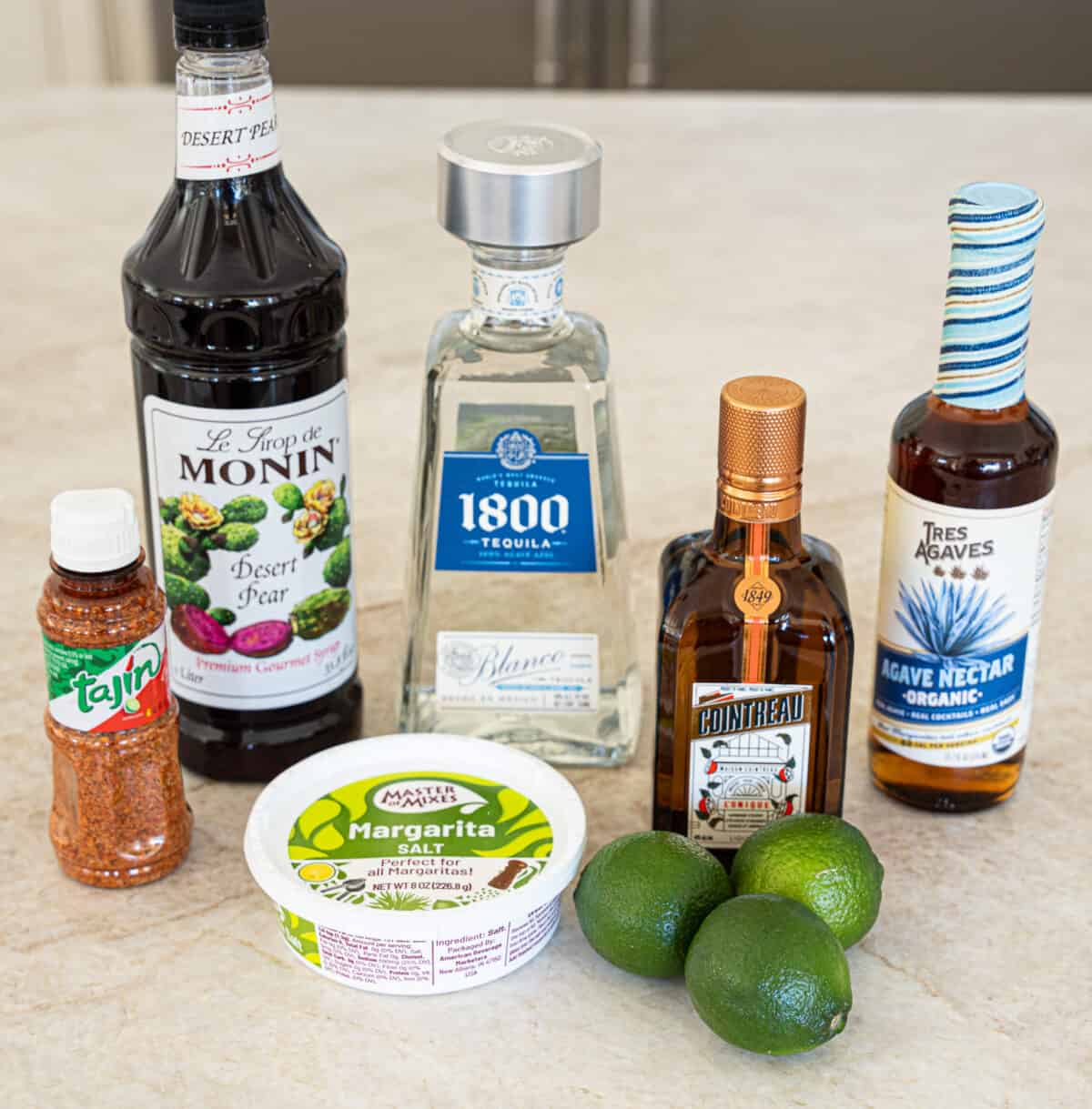 Prickly Pear Margarita ingredients including: Tajin, Desert pear syrup, Tequila, Margarita salt, Cointreau, Agave Nectar, Limes