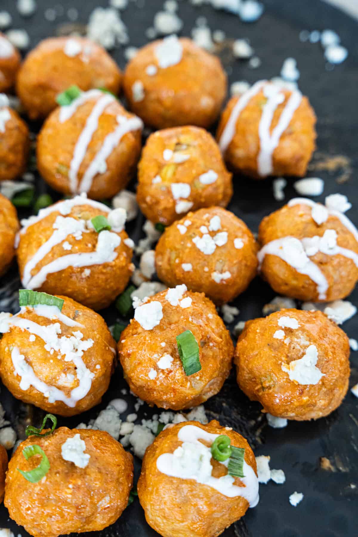 Buffalo Chicken Meatballs Topped with blue cheese and scallion